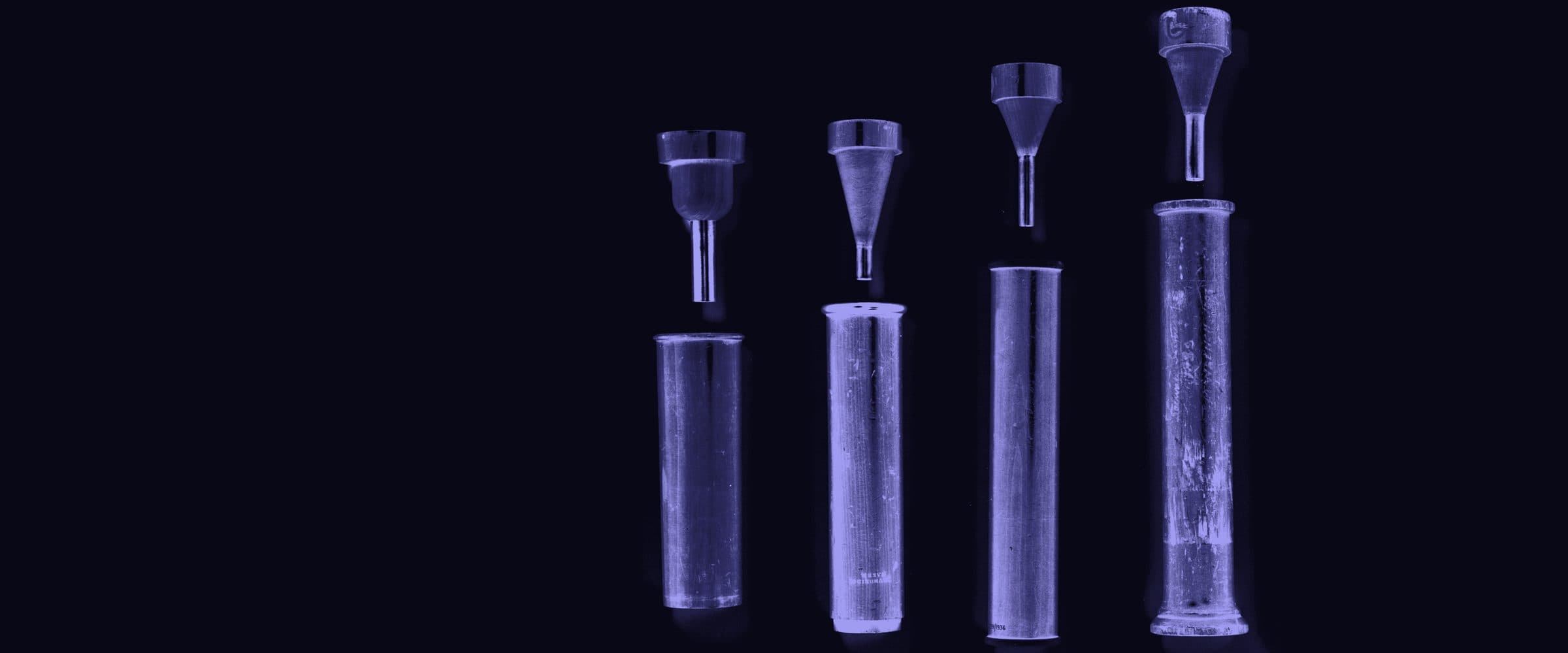Four early monaural stethoscopes of Laennec's wooden tube design.